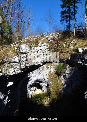 Natural karst rock formation little natural bridge in Rakov skocjan in Notranjska, Slovenia and zeljske jame bellow Stock Photo