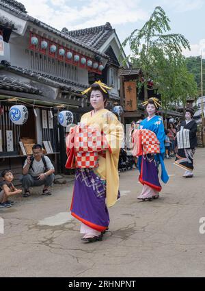 Oiran courtesans parade through the streets of Edomura Wonderland with ...