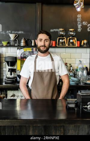 Hospitality staff. Barista handsome worker. Man cook wear apron. Mature  barista. Restaurant staff. Hipster professional barista apron uniform.  Waiter or bartender. Cafe bar barista job position Stock Photo - Alamy