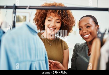 Fashion, shopping and women in a boutique for clothes, inspection and retail customer. Happy, together and girls, employees or designers showing Stock Photo