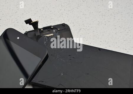 Closeup of a smartphone display, highlighting the concept of cell phone maintenance and repair. Great for illustrating the universe of technical assis Stock Photo