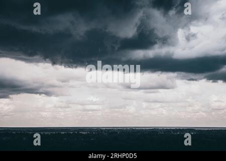 Dark sky and black clouds before rainy, Dramatic black cloud and thunderstorm Stock Photo