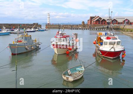 Fishing boats WK3 Kayleigh Ann LH29 Carrie B,  and vessels in sunny Newhaven harbour at high tide, Leith, Edinburgh, Scotland, UK, EH6 4LP Stock Photo