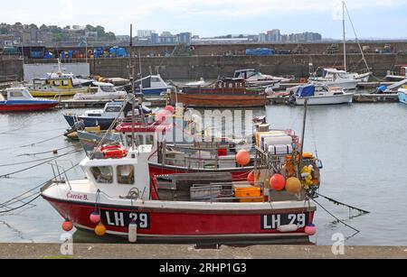 Fishing boats and vessels LH29 in sunny Newhaven harbour at high tide, Leith, Edinburgh, Scotland, UK, EH6 4LP Stock Photo