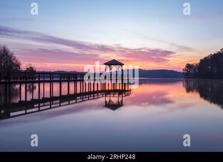 Sunrise, Lake Sidney Lanier - Hall County, Georgia. Early morning clouds reflect on the surface of Lake Lanier at War Hill Park. Stock Photo