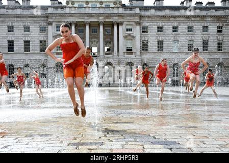 Dancers from Shobana Jeyasingh Dance rehearsing Counterpoint in the fountains at Somerset House ahead of this weekend’s performances as part of Westminster City Council’s Inside Out Festival .A group of 22 powerful women dance a duet with the iconic fountains of Somerset House in Counterpoint, created by Shobana Jeyasingh Dance and inspired by the stunning neoclassical architecture of the courtyard.   Date: 19 to 20 August - three performances each day, 10 minutes long, start times are listed on Somerset House's website. Stock Photo
