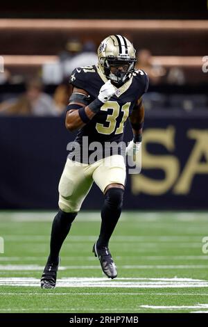 New Orleans, USA. 27th Aug, 2023. New Orleans Saints safety Jordan Howden  (31) tackles Houston Texans running back Dameon Pierce (31) during a  National Football League preseason game at the Caesars Superdome