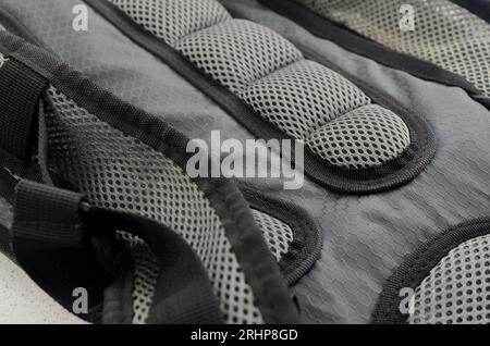 Detailed close-up of the stitching of a high-quality backpack, ensuring strength and comfort. Stock Photo