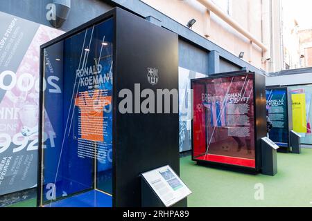 Barcelona, Spain - FEB 9, 2022: Sportsgear of the famous football players of Barcelona FC displayed at a temporary world cup exhibition in Barcelona, Stock Photo