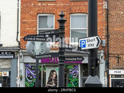 Tourist signpost pointing way to various attractions in Knaresborough Market Place, Knaresborough, North Yorkshire, England, UK Stock Photo