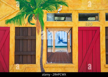 Key West, Florida, USA. Colourful facade of the Blue Macaw, a popular cocktail bar, Bahama Village, Old Town. Stock Photo