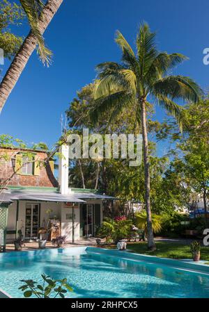 Key West, Florida, USA. View across swimming pool in grounds of the Ernest Hemingway Home and Museum, Old Town. Stock Photo