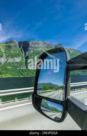 View in the rear view mirror on a road in Norway Stock Photo