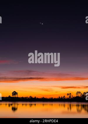 Venus and Jupiter Conjunction. Pine Glades Lake. The Everglades National Park. Florida. USA. Stock Photo