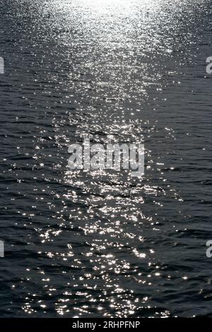 Germany, Bavaria, Upper Bavaria, Neuötting, river Inn, light reflections on the water surface, sunlight, backlight, waves Stock Photo
