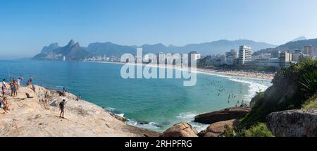 Rio de Janeiro, Brazil: Ipanema beach and city skyline from Arpoador rock, small peninsula between Ipanema and Copacabana, with The Dois Irmaos view Stock Photo