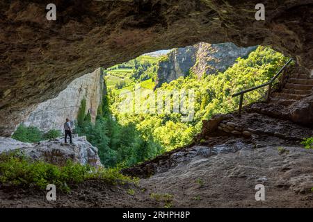 Tourist discovering of the hermitage Santa Giustina. Europe, Italy, Trentino South Tyrol, Non valley, Trento district, Ville d'Anaunia, Tassullo Stock Photo