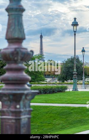Park 'Jardin des Tuileries' with lanterns in Paris, France, Eiffel Tower in background Stock Photo