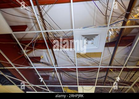 Interior building complex construction involves removal of old ceiling ...