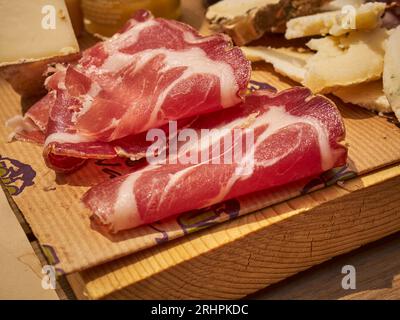 Cold cut board with prosciutto and cheese slices as served in Cuneo, Piemonte, Italy Stock Photo
