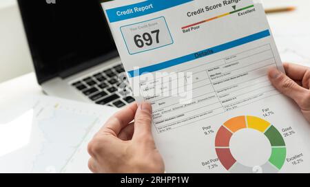 Credit Report with Score rating app on smartphone screen showing creditworthiness of a person for loan and mortgage application based on payment Stock Photo