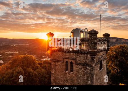 Germany, Thuringia, Suhl, sunrise next to Domberg tower, forest, back light Stock Photo