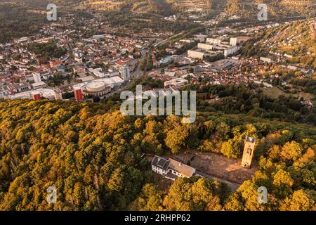 Germany, Thuringia, Suhl, Domberg tower, Dombergbaude, city in background, Congress Centrum (background), mountains, forest, overview, oblique view, aerial view Stock Photo