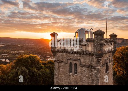 Germany, Thuringia, Suhl, sunrise next to Domberg tower, forest, overview, back light Stock Photo