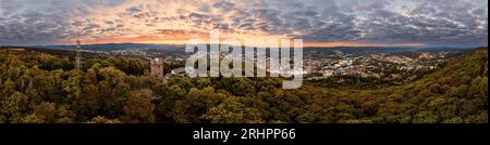 Germany, Thuringia, Suhl, Domberg tower, Dombergbaude, city in background, Congress Centrum, mountains, forest, dawn, overview, aerial view, 36ö° panorama Stock Photo