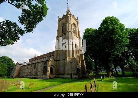 The priest of St. Paul and St. Peter's Church greets neighbours after ...