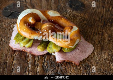 meatloaf slices in a pretzel on wood Stock Photo