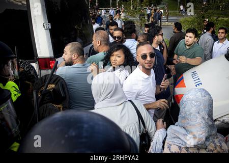 THE HAGUE - A counter-demonstration of Muslims against the demonstration of Pegida leader Edwin Wagensveld who tore up a Quran during a protest by anti-Islam movement Pegida in front of the Turkish embassy. Quran burnings in Denmark and Sweden caused a lot of social unrest there. ANP RAMON VAN FLYMEN netherlands out - belgium out Stock Photo