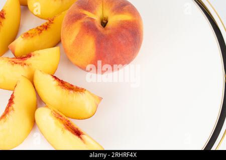 Sliced peaches on fancy plate Stock Photo