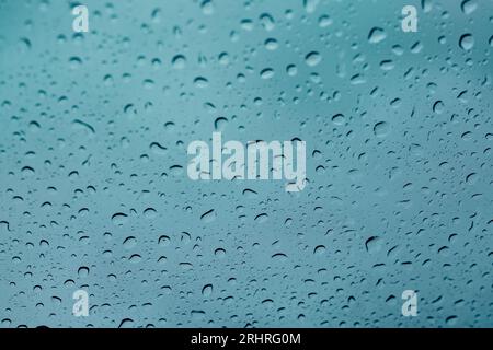 Rain water drops on glass close-up view Stock Photo