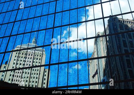 Historic buildings of Boston are reflected in the windows of the modern John Hancock Building Stock Photo