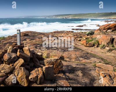 Cape to Cape track marker next to pounding surf north of Gracetown, Leeuwin-Naturaliste National Park, Western Australia Stock Photo