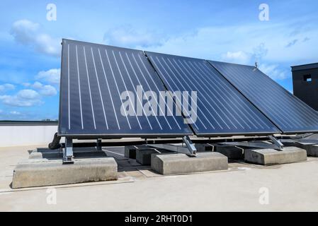 Heat pump and solar collector on the roof Stock Photo