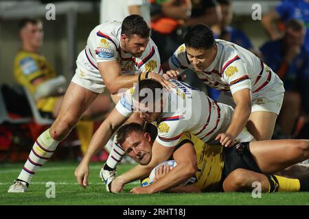 Wakefield, UK. 18th Aug, 2023. Be Well Support Stadium, Wakefield, West Yorkshire, 18th August 2023. Betfred Super League Wakefield Trinity vs Castleford Tigers Greg Eden of Castleford Tigers is tackled by Jay Pitts, Tom Lineham and Mason Lino of Wakefield Trinity Credit: Touchlinepics/Alamy Live News Stock Photo