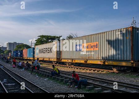 A shipping container trail cross the Airport Railway Station in Dhaka ...