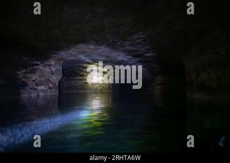 Kayaking a abandoned silica mine that is flooded with water. Stock Photo