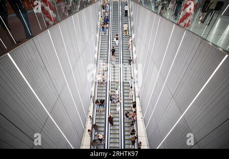 Tel Aviv. 18th Aug, 2023. Passengers take escalators at the light rail station Allenby in Tel Aviv, Israel on Aug. 18, 2023. About 100,000 people from across Israel enjoyed a free light rail ride along Tel Aviv's Red Line on Friday, to mark the first operative day of the line jointly built and operated by Chinese and Israeli companies. Credit: Chen Junqing/Xinhua/Alamy Live News Stock Photo