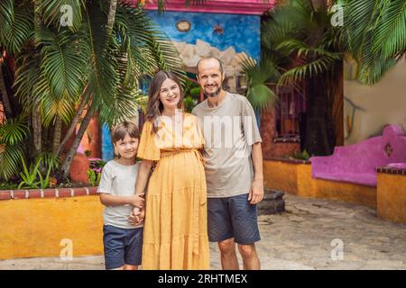 A loving couple in their 40s and their teenage son cherishing the miracle of childbirth in Mexico, embracing the journey of parenthood with joy and Stock Photo
