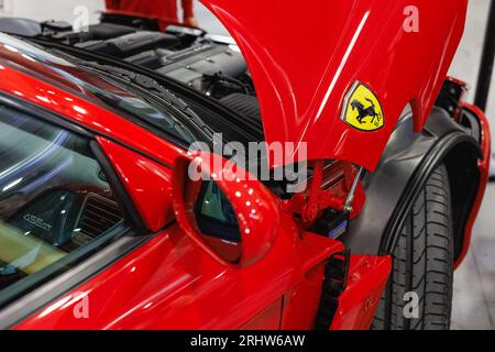 Engine of a Ferrari 456 with an Open Hood. Stock Photo