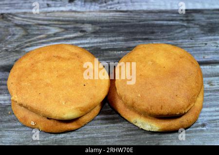 Round Egyptian pastries made of flour plain or stuffed with ajwa, agwa or pressed dates fruit, baked in the oven, usually served beside tea, Tradition Stock Photo