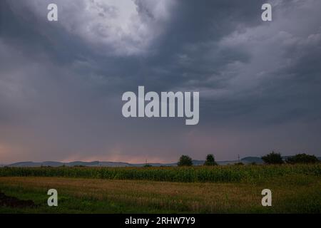 Early morning storm clouds moving over the countryside in Transylvania, Romania. Stock Photo
