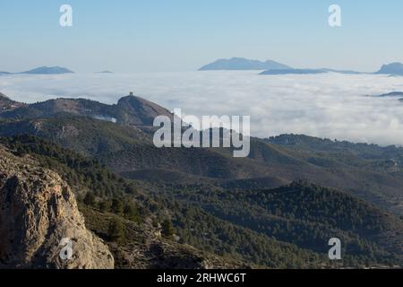 Dense fog in the Cocentaina valley from the Alt de les Pedreres in Alcoi, Spain Stock Photo