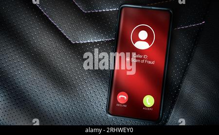 Top view of smartphone with spam call on screen. Smartphone incoming unwanted call. Spam, scam, phishing and fraud concept. Security technology. Stock Photo
