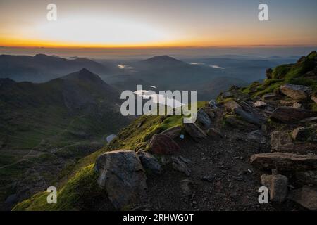Sunrise on the top of Mount Snowdon, Yr Wyddfa in North Wales. Stock Photo