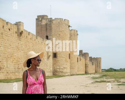 Young woman sightseening Aigues-Mortes, France Stock Photo