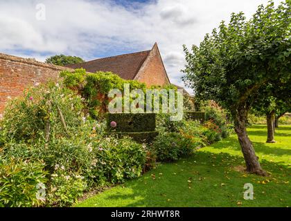 Extensive vibrant gardens at The Manor House in Baddesley Clinton, Warwickshire, UK. Stock Photo